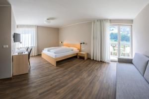 Postel nebo postele na pokoji v ubytování Hotel Untermelz + 21 fotografií