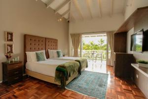 Ένα ή περισσότερα κρεβάτια σε δωμάτιο στο Hotel Boutique El Triángulo