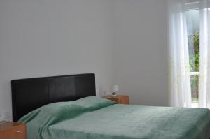 Postel nebo postele na pokoji v ubytování Apartments Matej & Irena