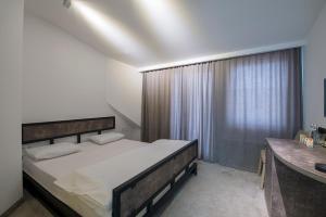 Postel nebo postele na pokoji v ubytování Hotel Opinion