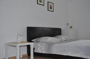 Postel nebo postele na pokoji v ubytování Apartments Matej & Irena