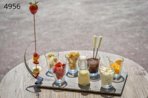 a tray of different drinks on a table at Hôtel George Sand in La Seyne-sur-Mer