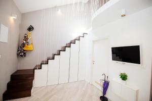 Televízia a/alebo spoločenská miestnosť v ubytovaní Apartment 63 - 1