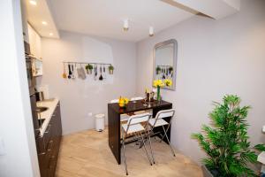a small kitchen with a table and a mirror at Apartment 63 - 1 in Zagreb