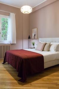 Lova arba lovos apgyvendinimo įstaigoje Classy & Charming 1BD Apartment in Kolonaki by UPSTREET