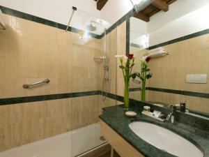 A bathroom at IG Suites