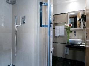 A bathroom at IG Suites