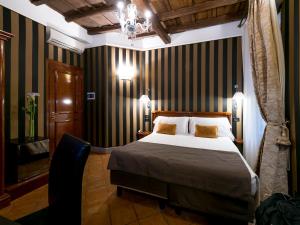 A bed or beds in a room at IG Suites