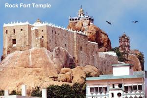 a castle on top of a mountain with two towers at Pleasant Stay in Tiruchchirāppalli