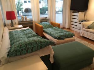 Ένα ή περισσότερα κρεβάτια σε δωμάτιο στο Ferienwohnung in Bonn