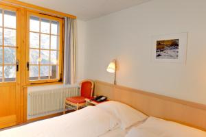Voodi või voodid majutusasutuse Hotel Alpenruh toas
