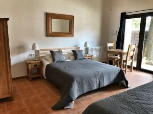 Posteľ alebo postele v izbe v ubytovaní Hotel Mas Pelegri