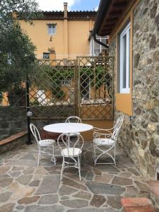 a table and chairs sitting on a patio at Il Casalone in Impruneta