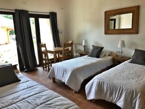 Posteľ alebo postele v izbe v ubytovaní Hotel Mas Pelegri