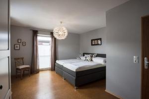 מיטה או מיטות בחדר ב-Ferienwohnung im Aalbachtal - Uettingen bei Würzburg