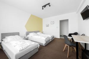 Posteľ alebo postele v izbe v ubytovaní Chesscom Hotel