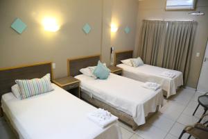 Katil atau katil-katil dalam bilik di Arthur Palace Hotel