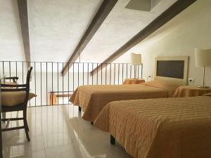 Voodi või voodid majutusasutuse La Cipriana toas