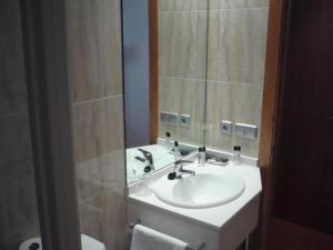 a bathroom with a sink and a mirror at Valcarce Urbasa in Olazagutía