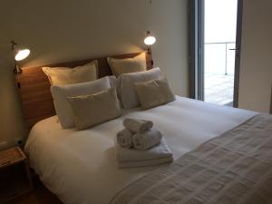 Postel nebo postele na pokoji v ubytování Casa dos Loureiros