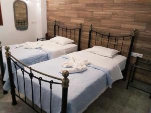 Posteľ alebo postele v izbe v ubytovaní Naxos Summerland resort