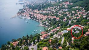 an aerial view of a town with a red circle at Apartments Green Garden in Opatija