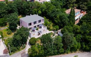 an aerial view of a house in the trees at Apartments Green Garden in Opatija