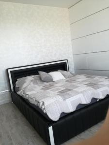 Posteľ alebo postele v izbe v ubytovaní Ambiente
