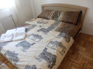 Postel nebo postele na pokoji v ubytování Apartment Erika