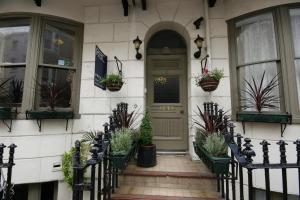 a front door of a house with potted plants at Paskins Town House in Brighton & Hove