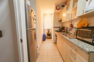 Η κουζίνα ή μικρή κουζίνα στο Apartamento hogareño +4 φωτογραφίες