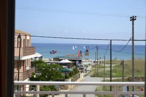 a view of the beach from a balcony at Kalias Hotel in Vasiliki