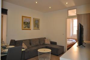 a living room with a couch and a table at Apartment Nana in Piran