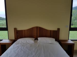 Postel nebo postele na pokoji v ubytování Taroko Formosa Homestay
