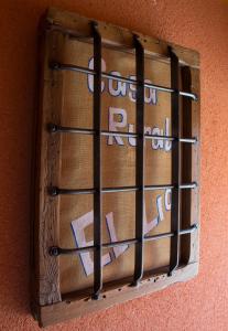 a wooden window with bars on a wall at Casa Rural El Lio in Ruidera