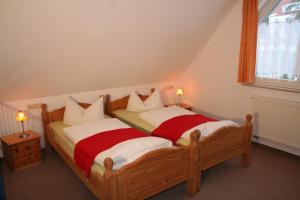 מיטה או מיטות בחדר ב-Zum Schlossgarten
