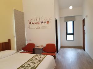 Postel nebo postele na pokoji v ubytování Taroko Formosa Homestay