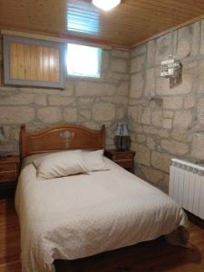 Postel nebo postele na pokoji v ubytování La Torre Mondariz