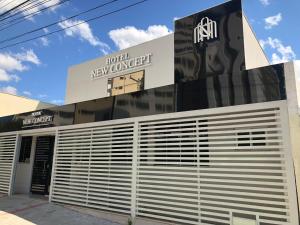 a building with a new converge sign on it at New Concept Hotel in Goiânia