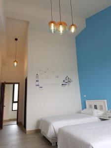 Postel nebo postele na pokoji v ubytování Taroko Formosa Homestay