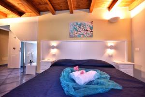 Postel nebo postele na pokoji v ubytování Residenza Vinci Room & Suite