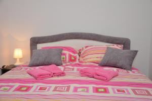 Кровать или кровати в номере Apartman Ksenija