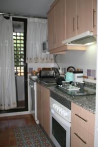 a kitchen with a stove and a counter top at You & Me in Jávea