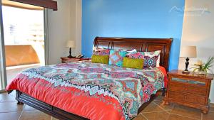 A bed or beds in a room at Bella Sirena Rocky Point by Castaways