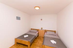 Posteľ alebo postele v izbe v ubytovaní House Iva