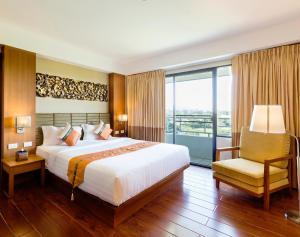 Cama ou camas em um quarto em Asia Hotels Group (Poonpetch Chiangmai)