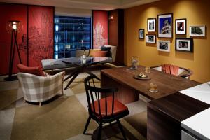 a living room with a table and chairs at Hyatt Centric Ginza Tokyo in Tokyo