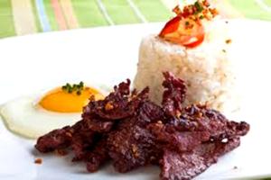 a piece of cake sitting on a white plate at Lost Horizon Beach Dive Resort in Panglao Island