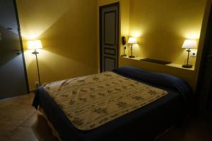 Postel nebo postele na pokoji v ubytování Hotel Le Saint Jean