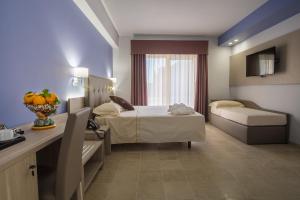 Krevet ili kreveti u jedinici u okviru objekta Netum Hotel